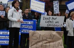 Burnaby opponents rally outside school board