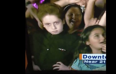 Watch: Legendary child in background of news broadcast