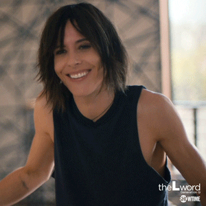 Shane shakes her head and smiles on The L Word Generation Q