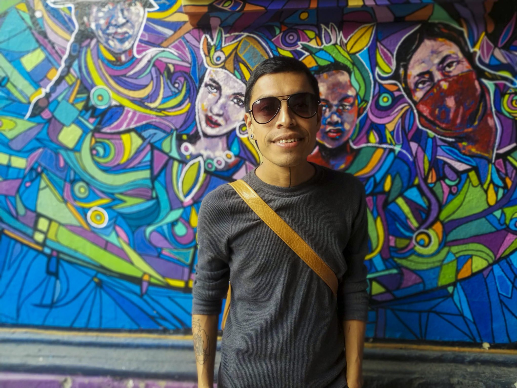 Manuel Tzoc poses on a graffiti wall on Feb. 11, 2020, in Guatemala City.