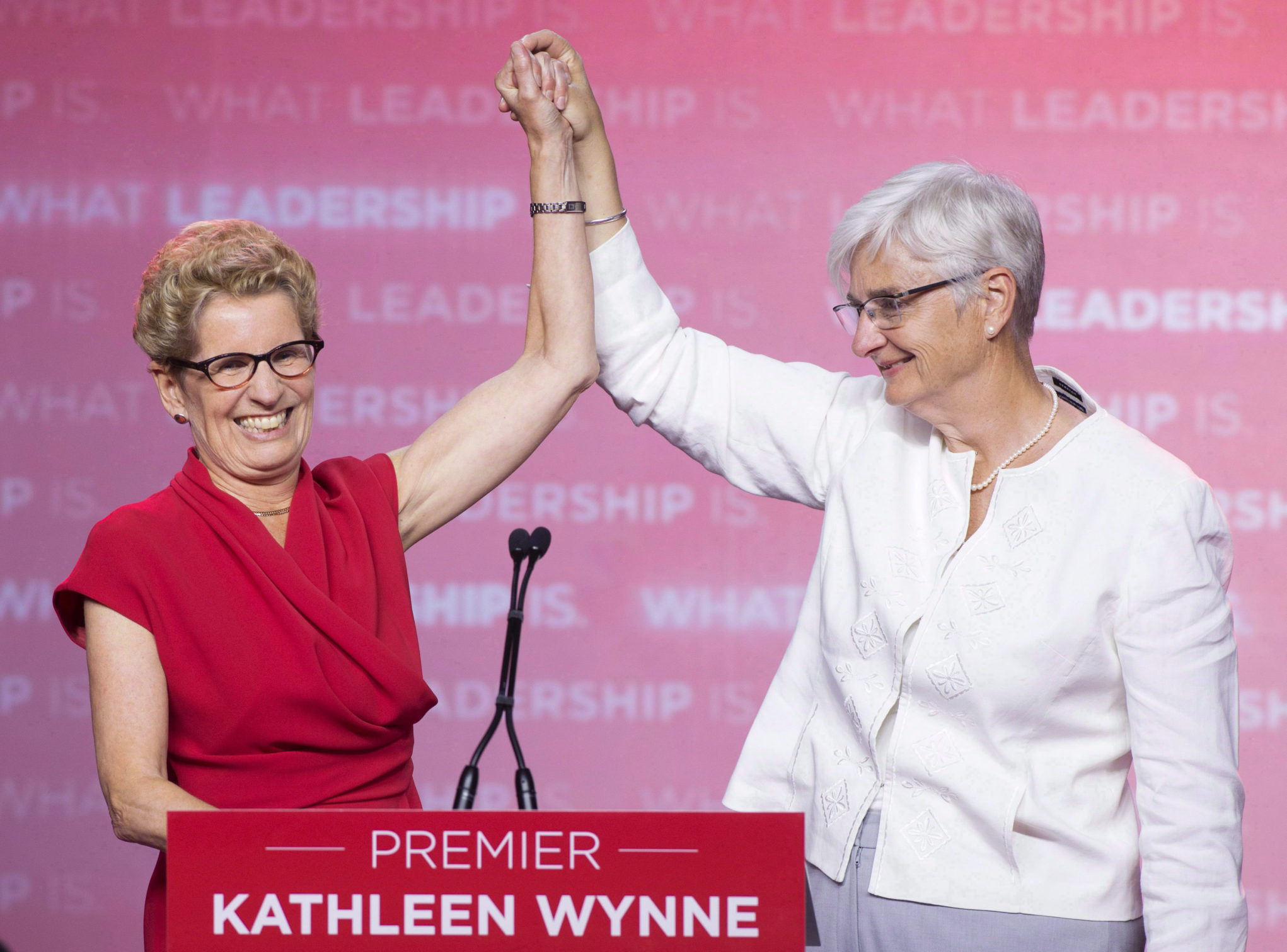 Former Ontario premier Kathleen Wynne celebrates with partner Jane Rounthwaite after winning the provincial election in Toronto on June 12, 2014.