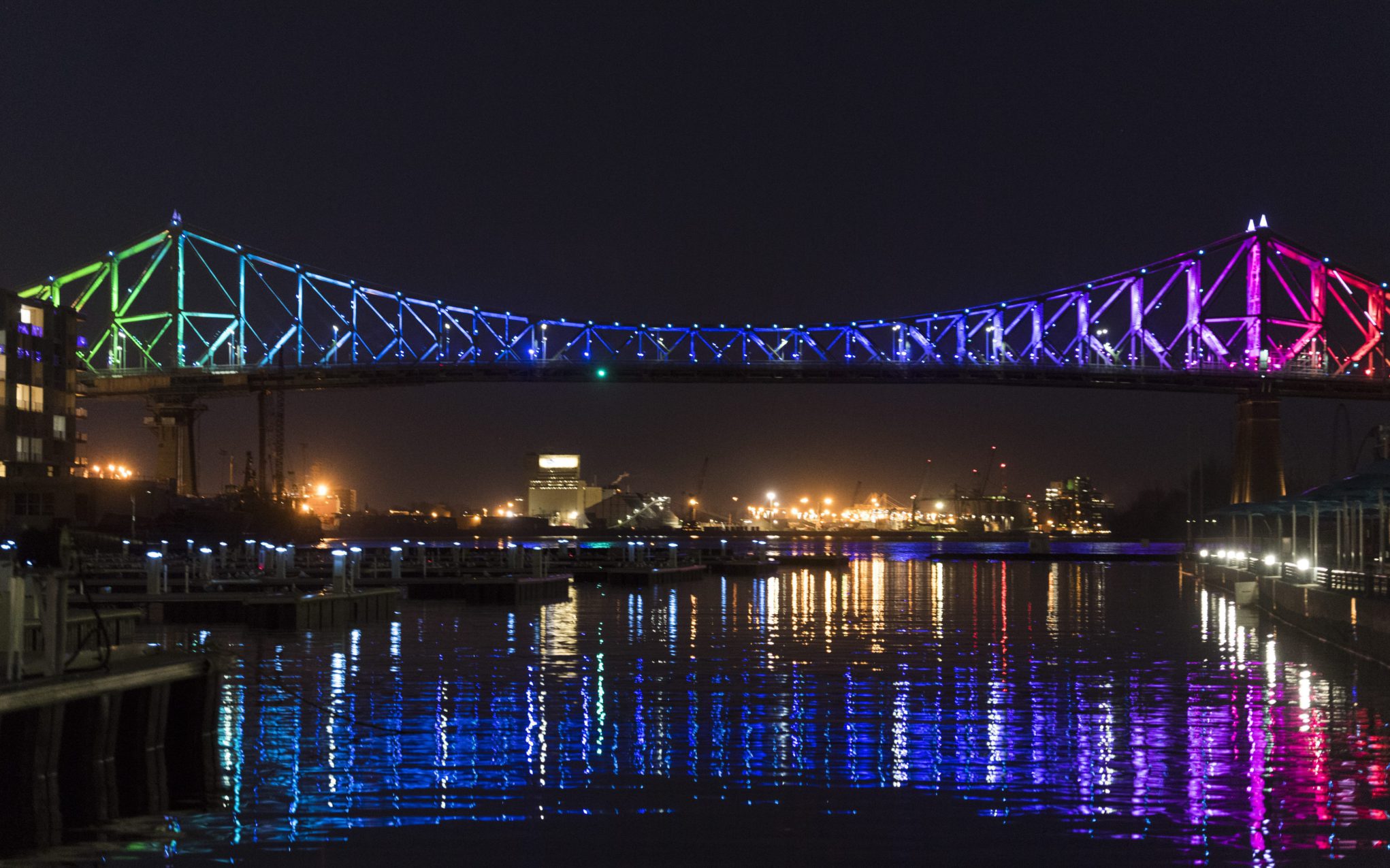 The Jacques Cartier bridge in the Old Port of Montreal, is lit up in rainbow colours during the COVID-19 pandemic. 