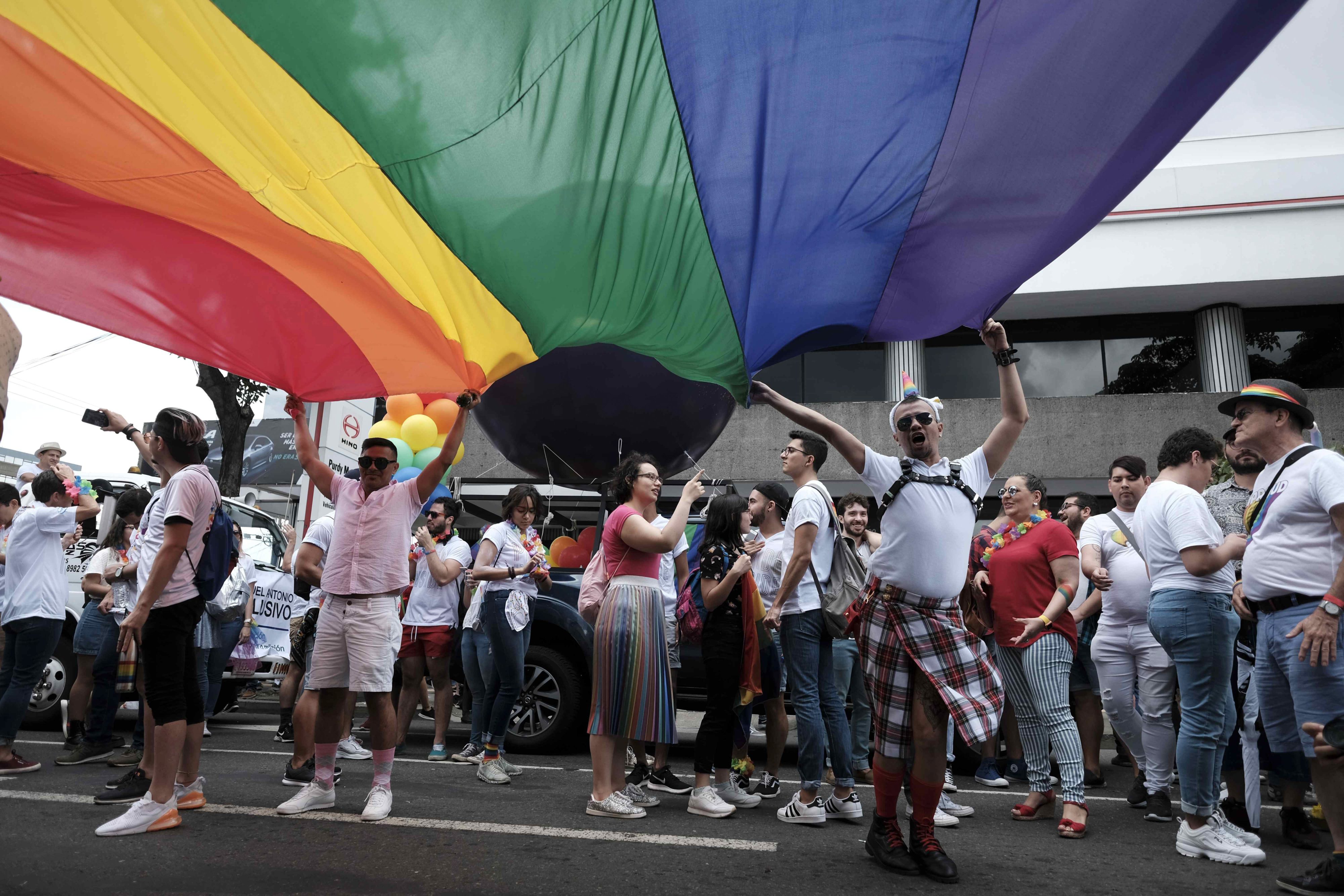 People participate in the Pride March in San Jose, Costa Rica in 2019. The march was the first held since the country legalized same-sex marriage, a reform that didn't go into effect until May 2020.
