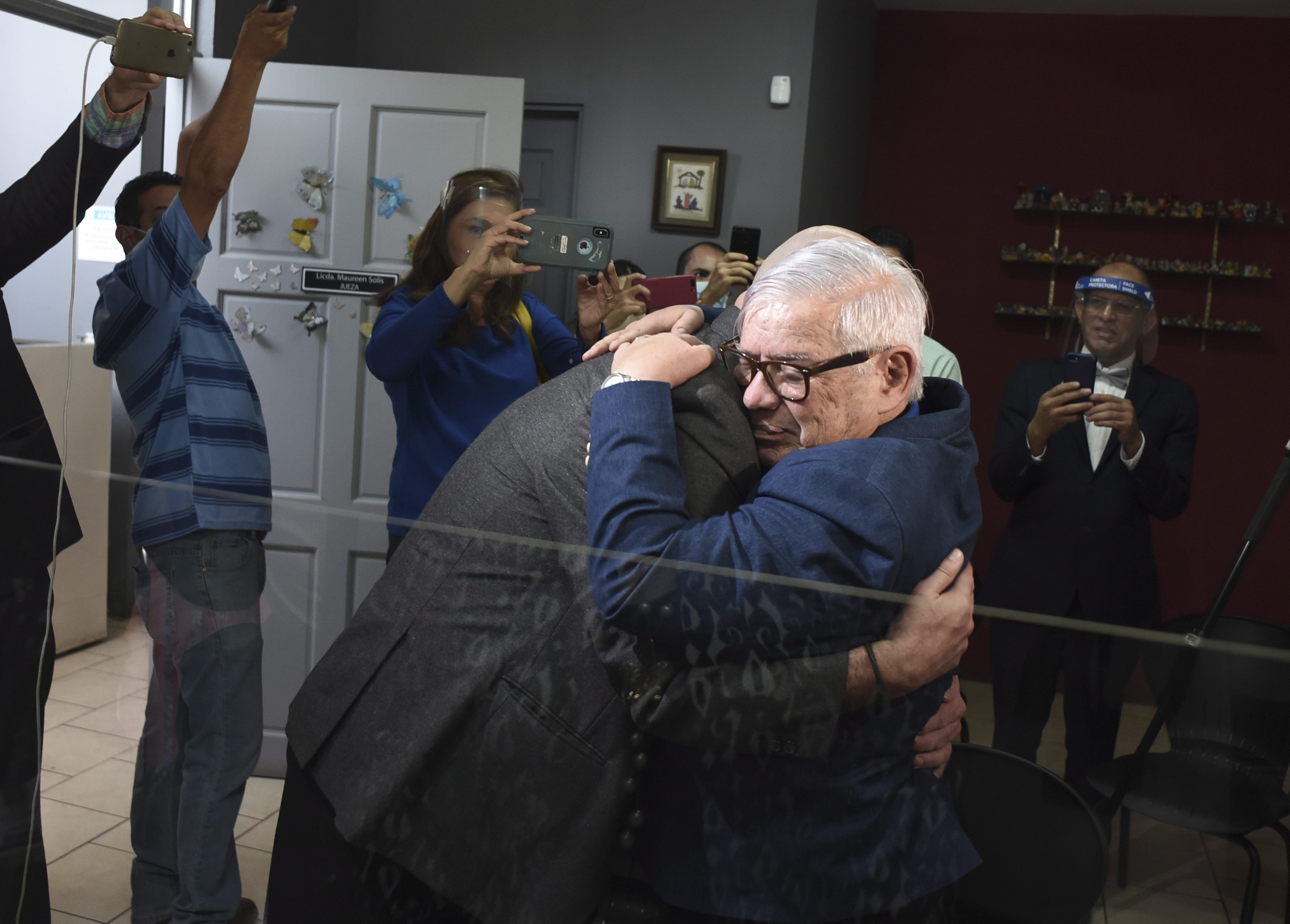 Activist Marco Castillo (right) embraces his husband Rodrigo Campos after they were married before a judge in San José, Costa Rica, on May 26, 2020, the day same-sex marriage became legal in the country.