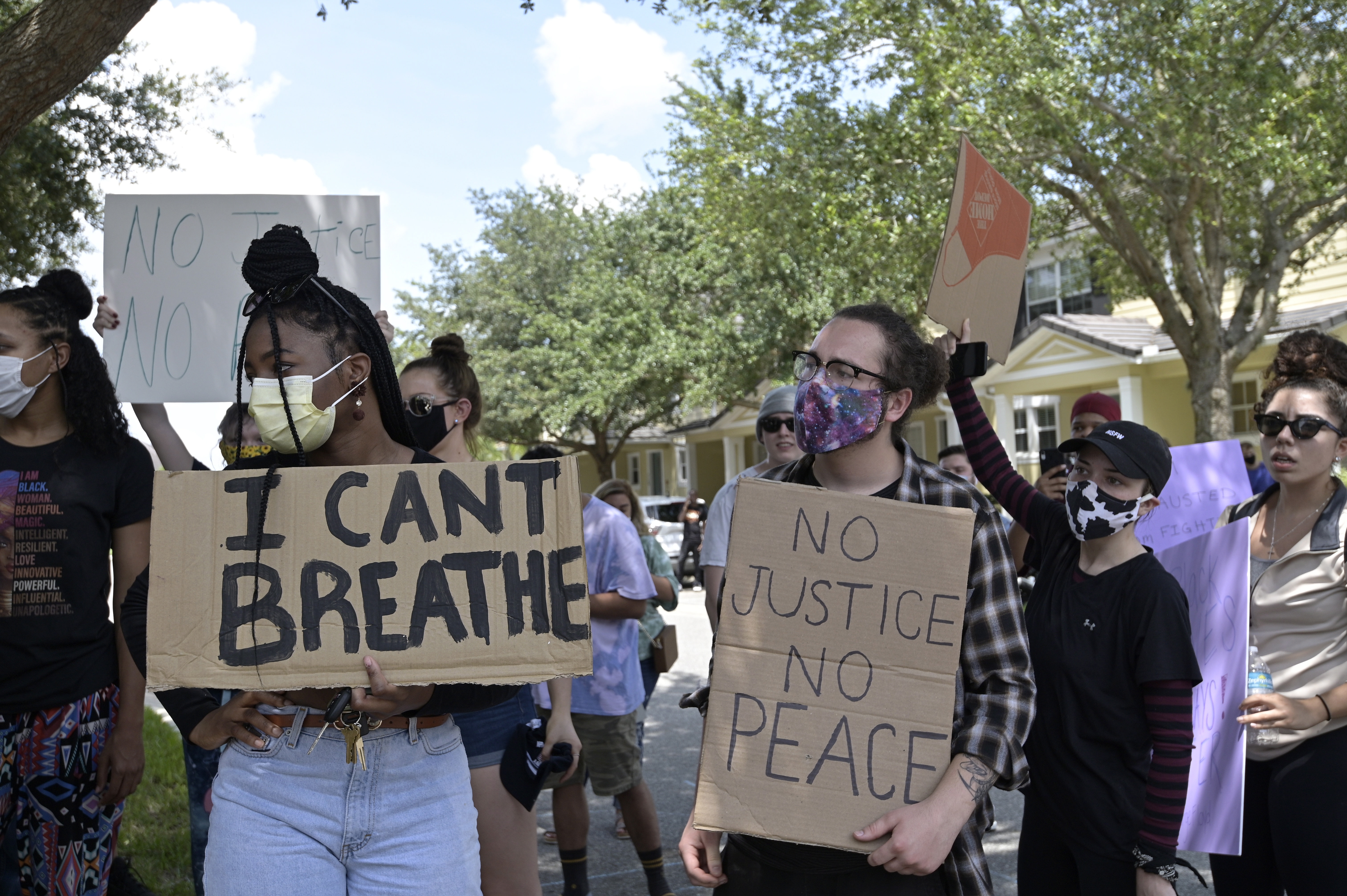 Protesters demonstrate in front of a townhouse owned by Minneapolis police officer Derek Chauvin, in Florida. Chauvin was one of four officers charged with the murder of George Floyd.