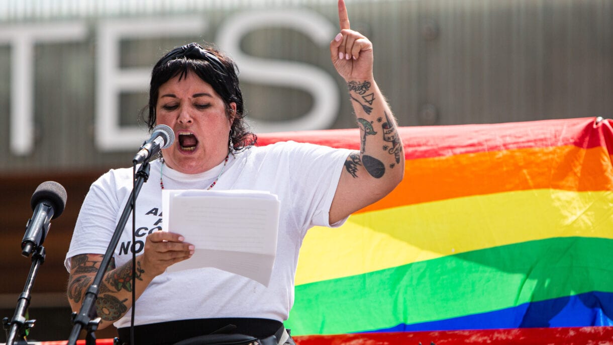 Harm reduction worker and community activist Zoe Dodd addresses the crowd at Nathan Phillips Square.