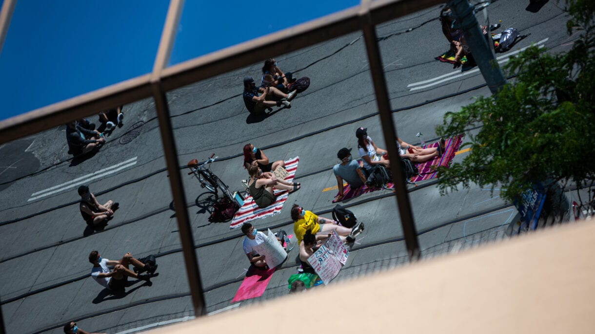 Thousands of people occupied the all of Bay Street, from College to Queen, sitting in physically distanced groups.