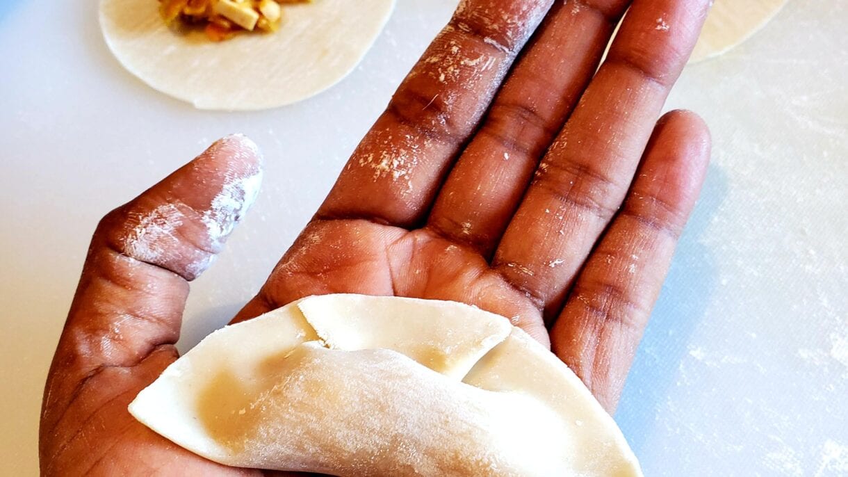 Ready to cook: a dumpling with its sealing pleat.