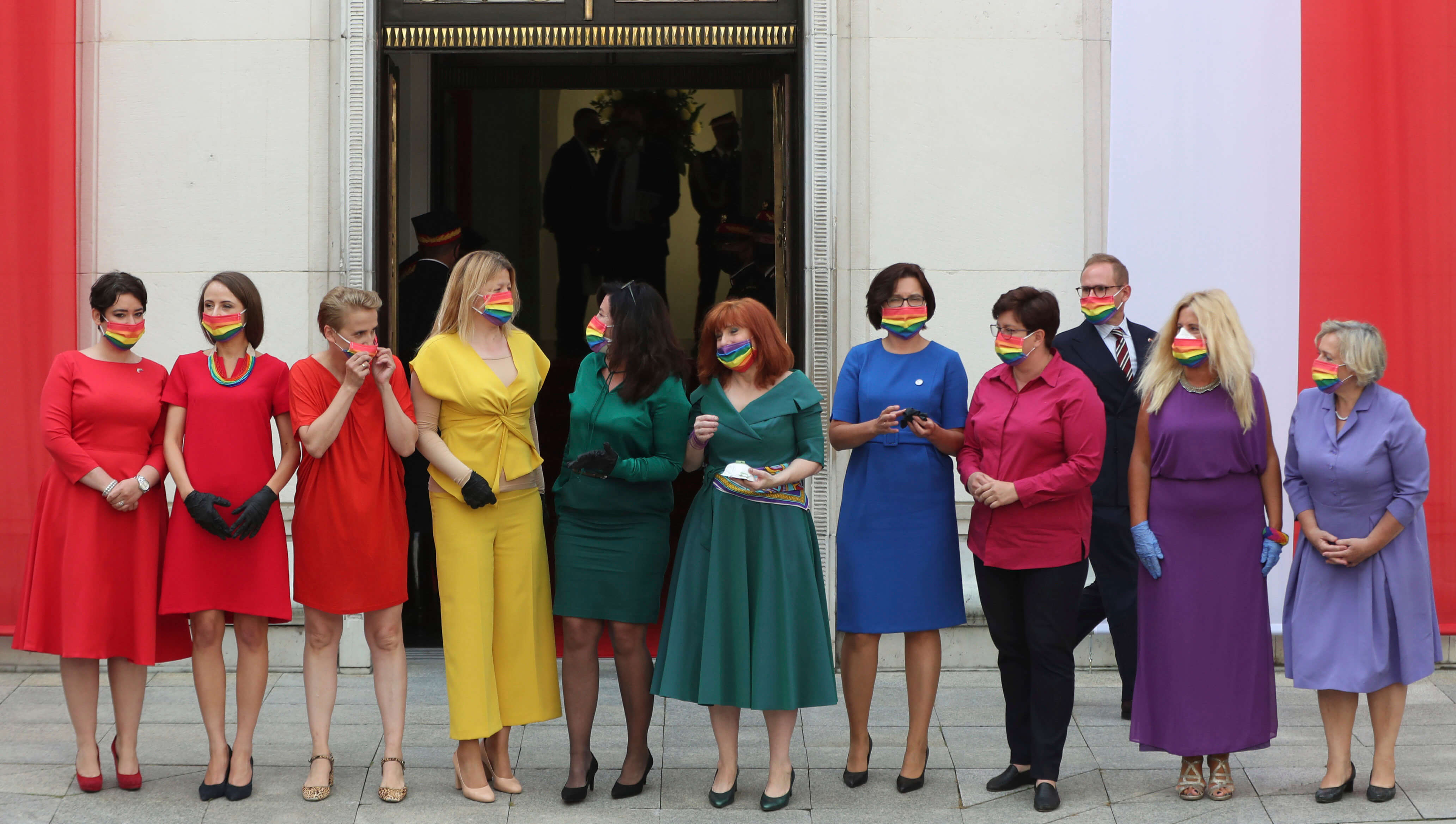 Poland's left-wing lawmakers dressed in rainbow colours to show support for the LGBTQ community outside the parliament building ahead of the swearing in ceremony of President Andrzej Duda for a second term.