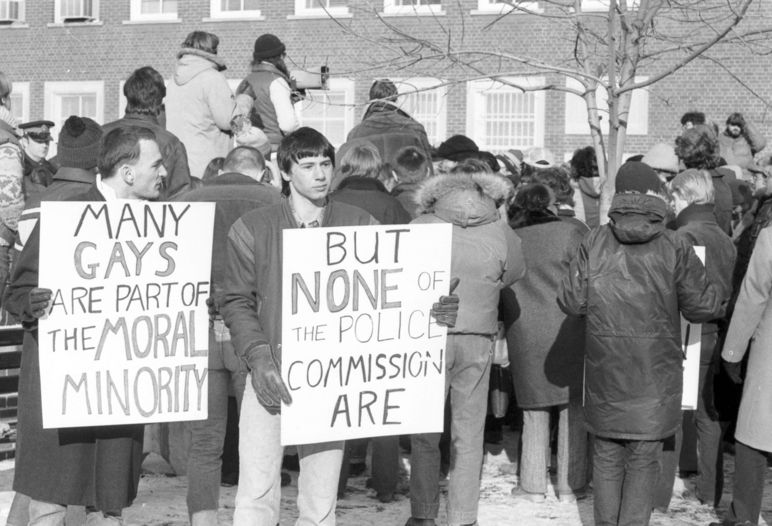 An overflow crowd waits outside Metropolitan Toronto Police Headquarters on Jarvis Street while their supporters argue for a public inquiry, Feb. 12, 1981.