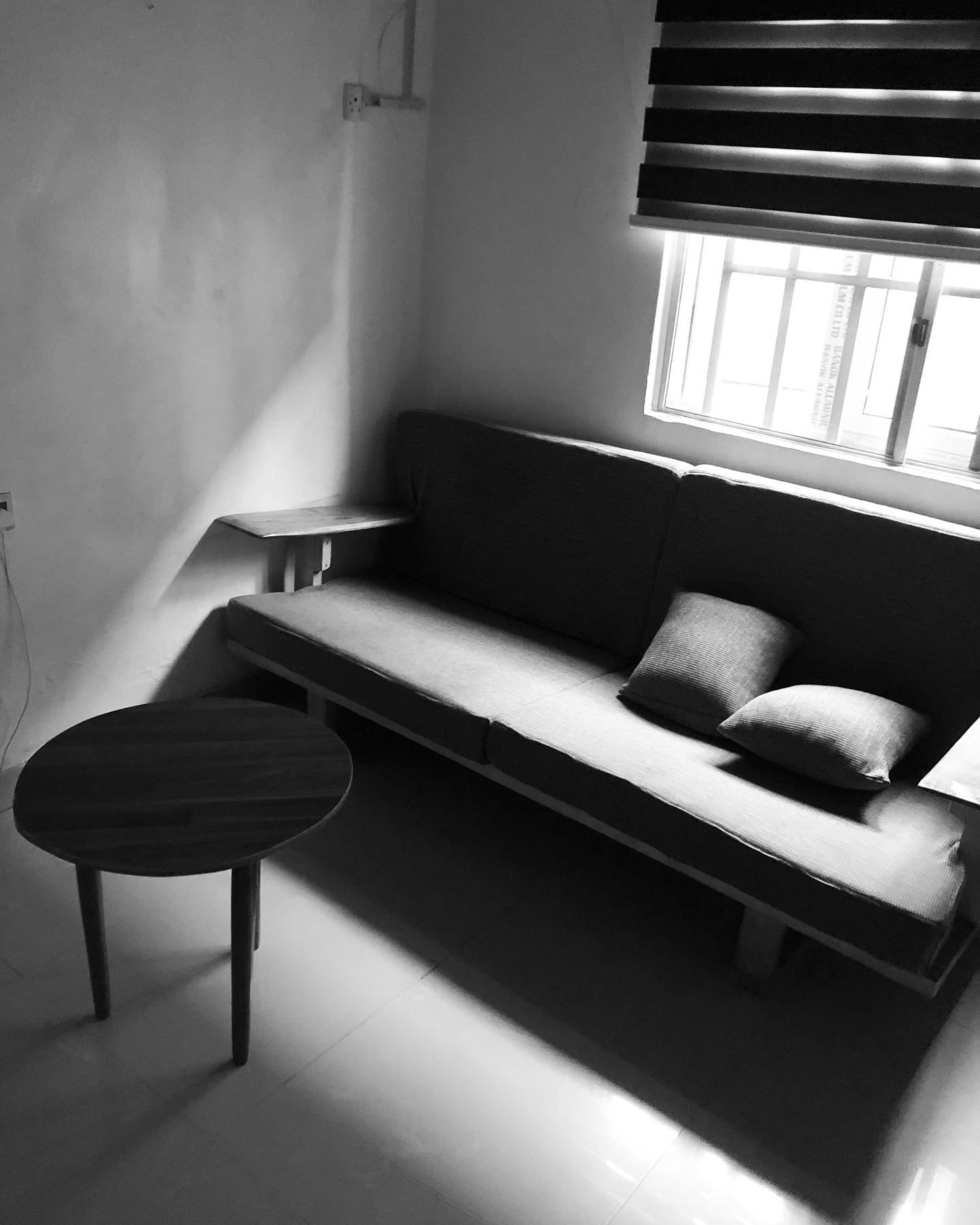A sofa and table in Nelson C.J's apartment