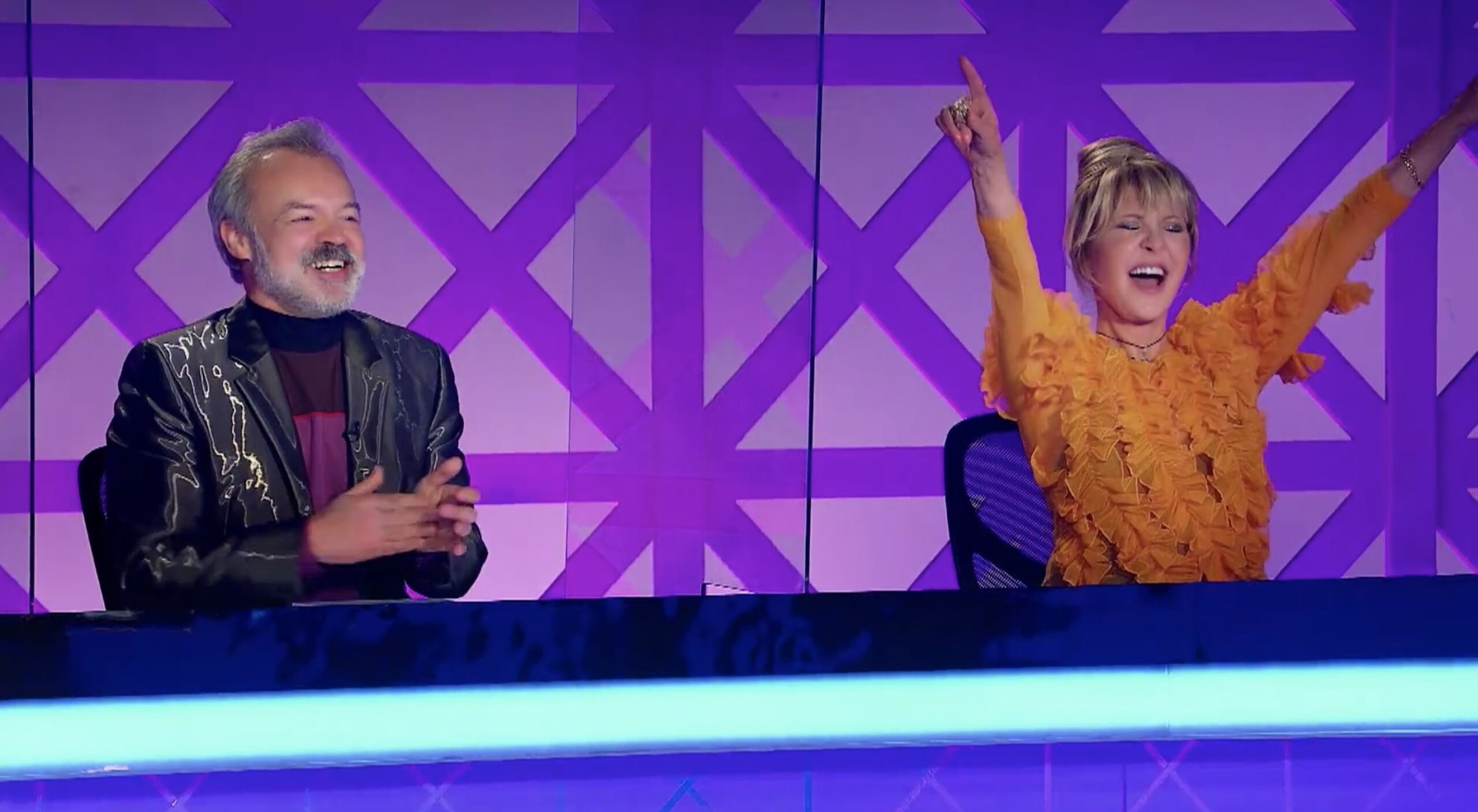 Graham Norton and Lulu watch a lip sync cover of "Shout"