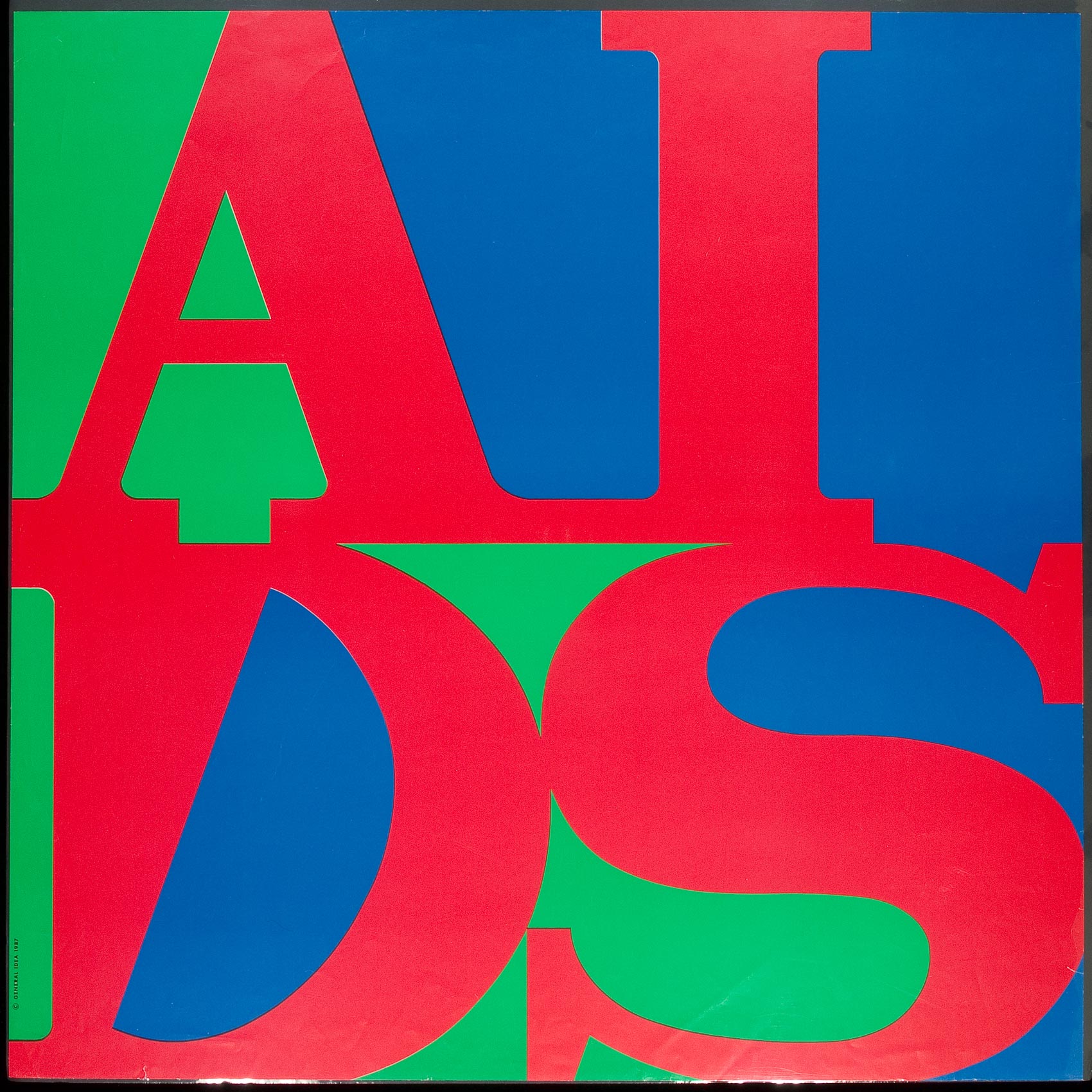 The letters a i d s in red serif font squished into a square surrounded by blue and green negative spaces.