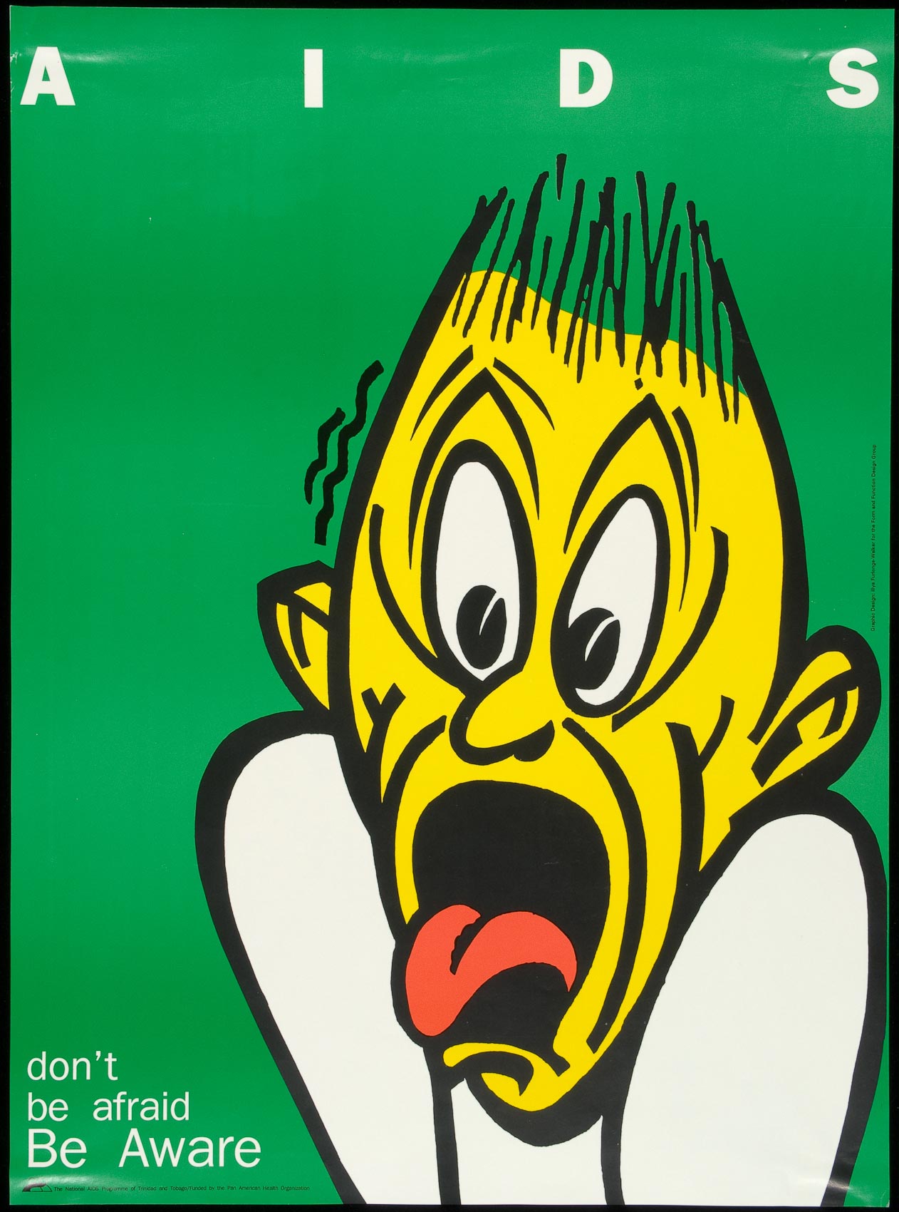 A cartoon face painted yellow with hair standing straight. up and mouth wide open.