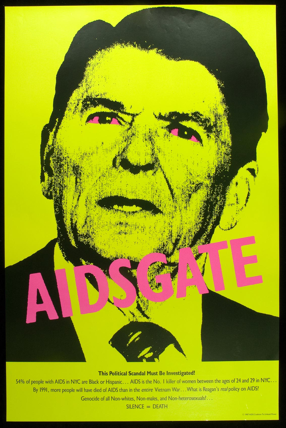 An image of Ronal Reagan in lurid lime green and black, his eyes the same pink as the text which reads AIDSGATE.