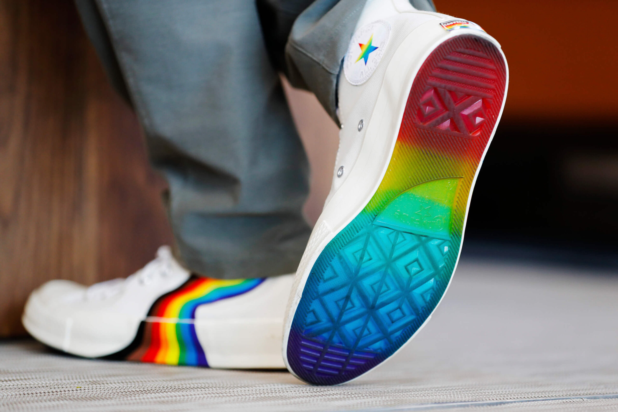 Vettel walks away, showing off his rainbow Converse sneakers, including completely rainbow sole