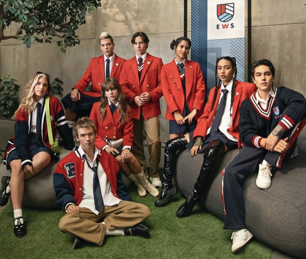 the cast of rebelde, in their red school uniforms