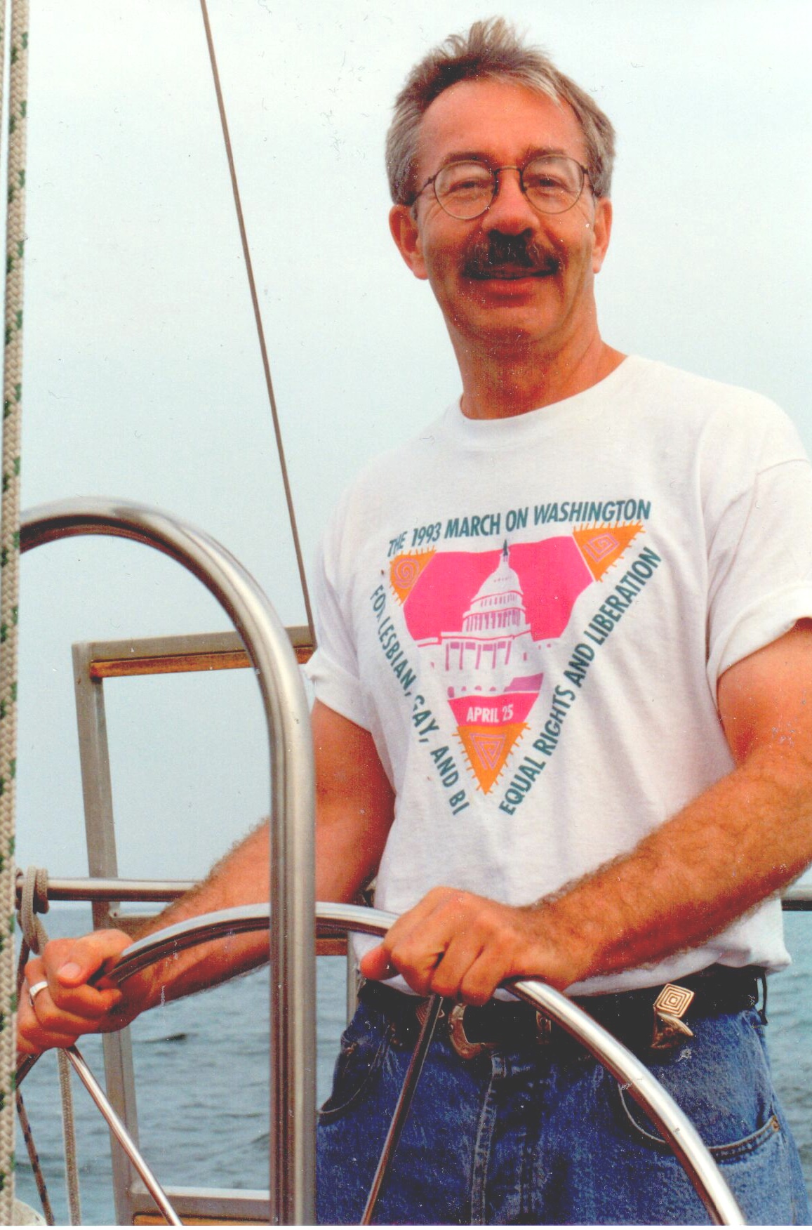 Gerald Hannon steers boat
