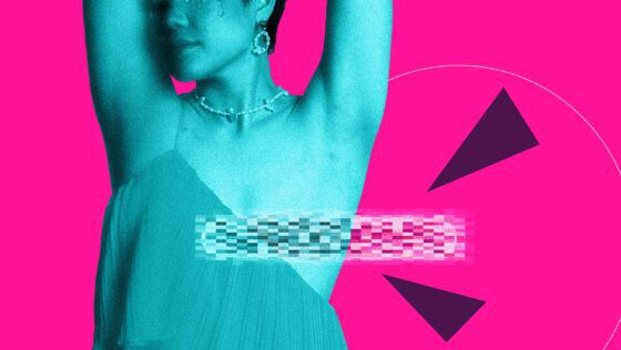 A person in earrings, a necklace and a dress or blouse with a single strap. One of their nipples would otherwise be showing but is censored by a bar.