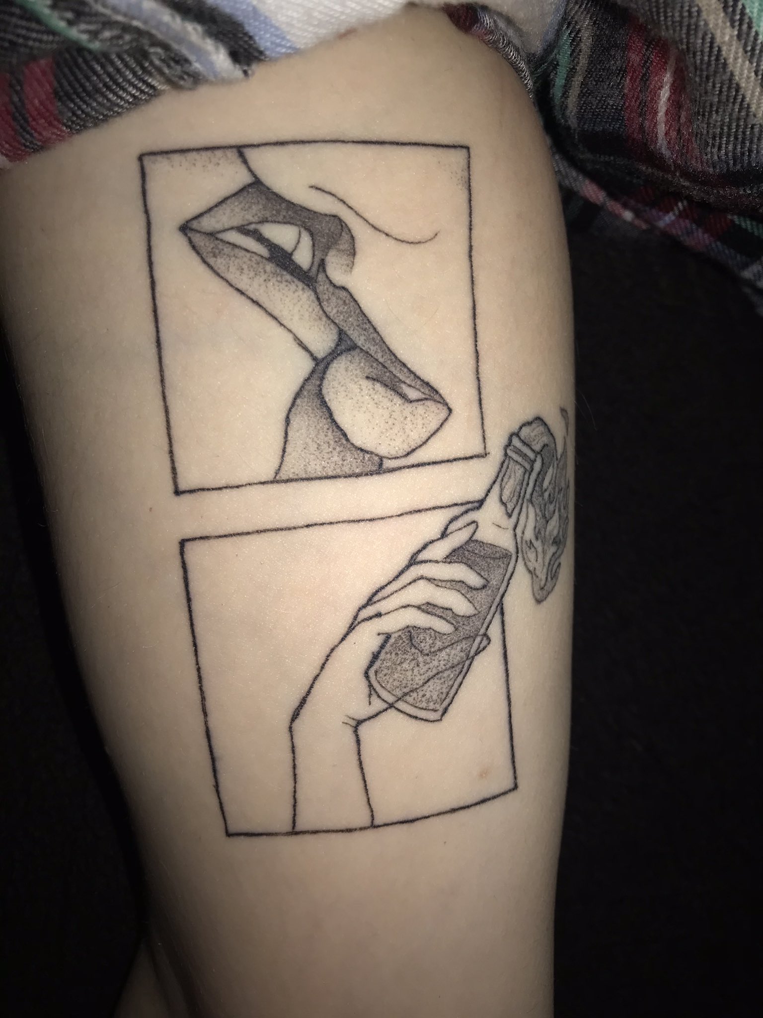 A tattoo of two feminine lips kissing above a Molotov cocktail