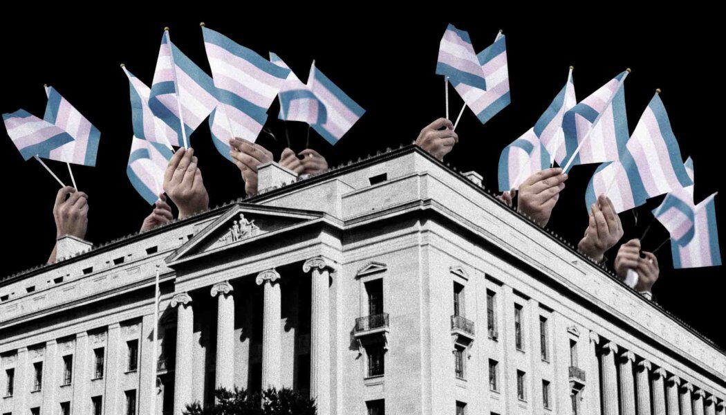 The Justice Dept. building in D.C., with hands carrying trans flags above it.