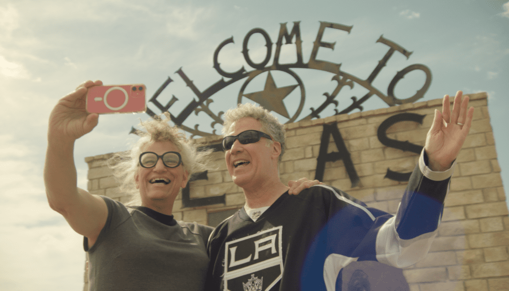 Still from Will & Harper of Will Ferrell and Harper Steele taking a selfie in front of a "Welcome to Texas" sign