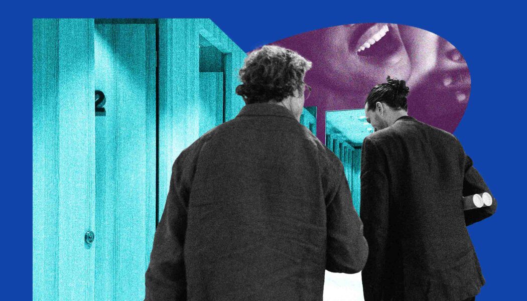 Two people seen from behind walking next to change-room doors