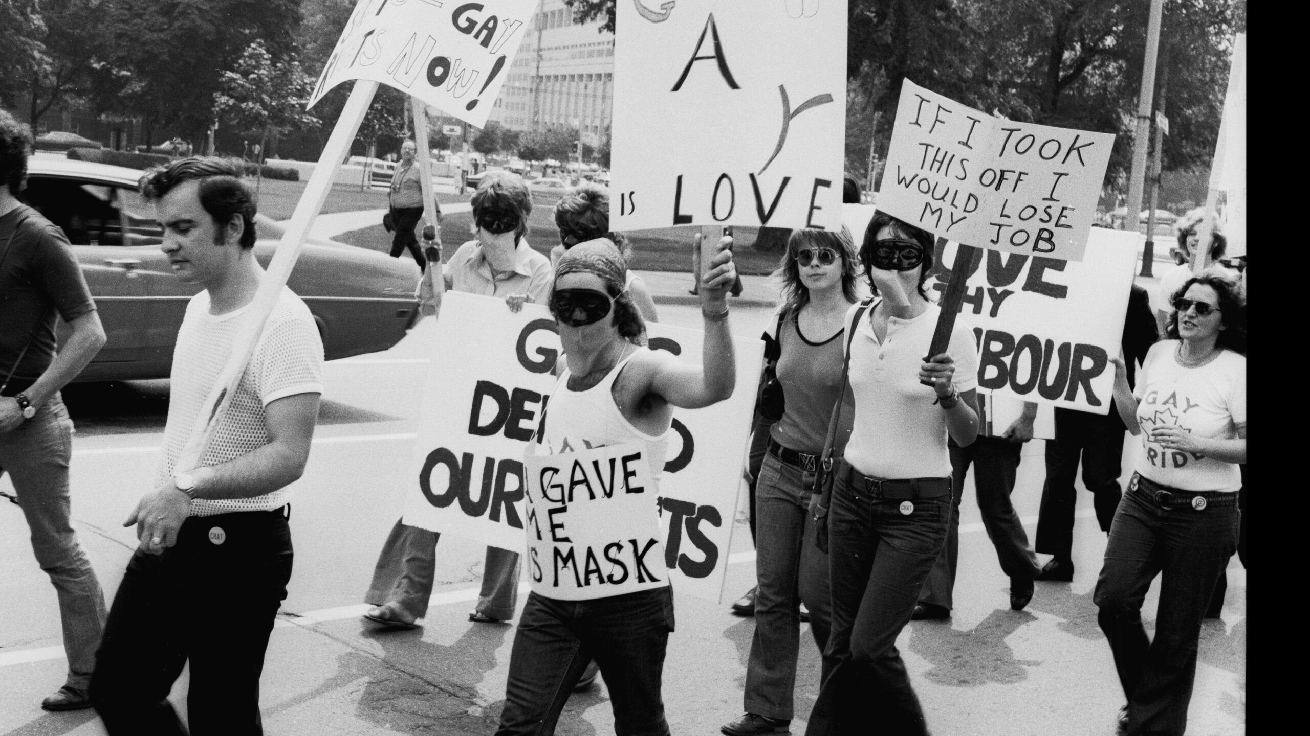 Lesbians march in masks concealing their identities in Toronto in 1973
