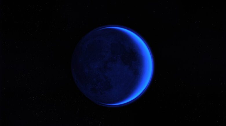 A blue moon in a dark sky.