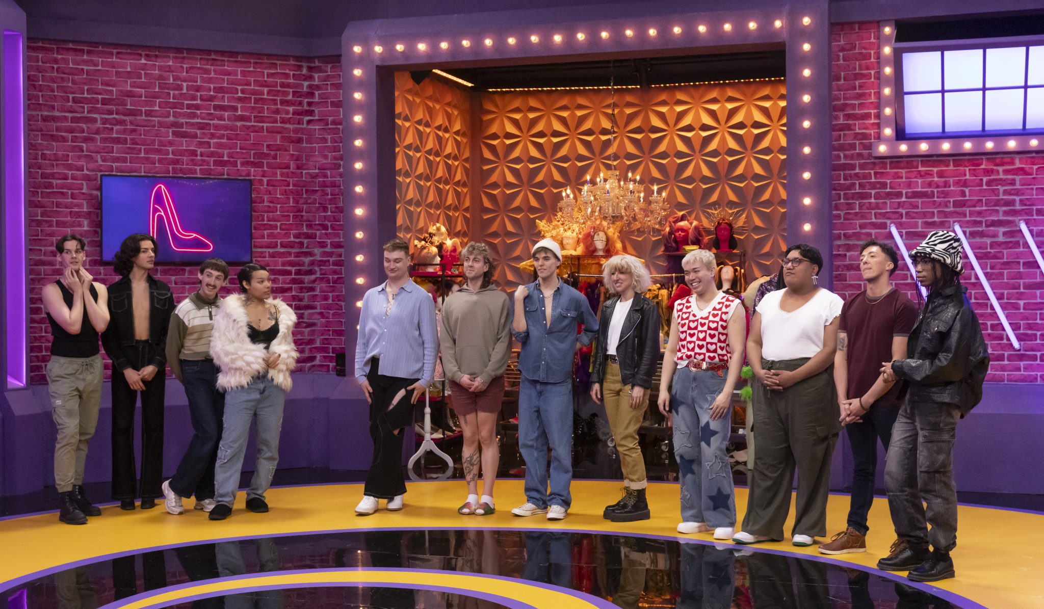 The 12 Seasons 6 queens standing in a line in the werk room