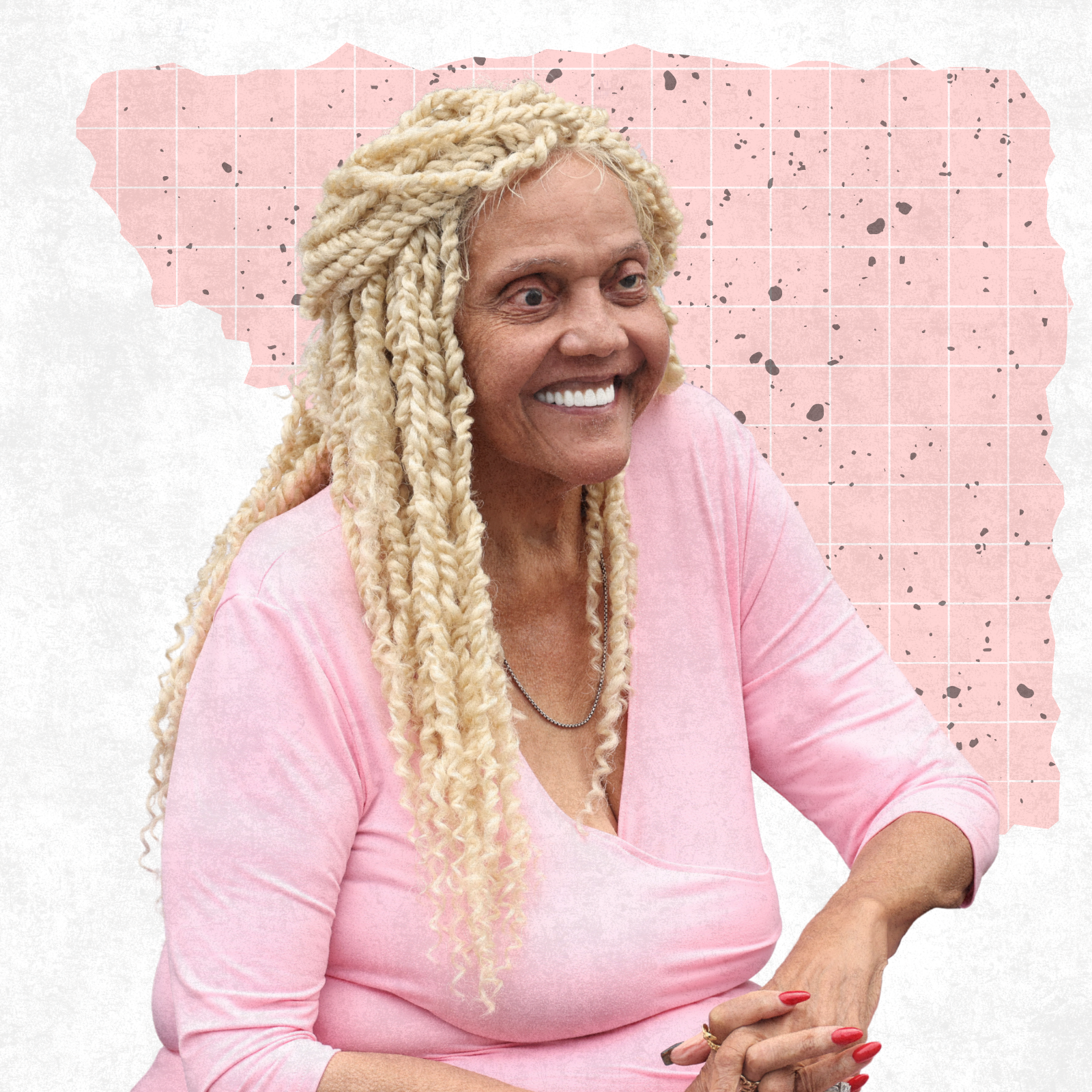 Miss Major smiling against an abstract pink and white background