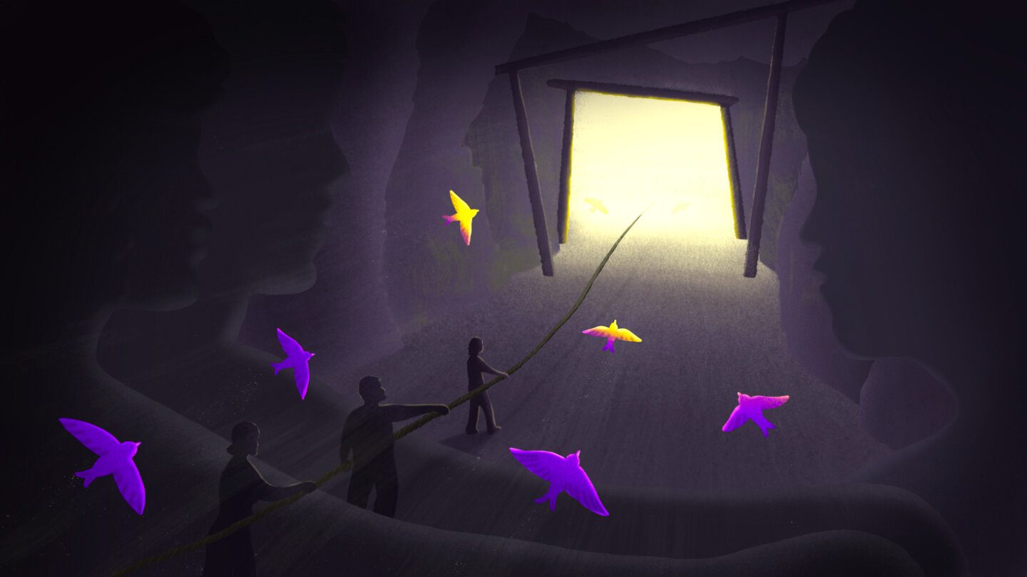 Illustration of three shadowy figures in a mine, holding a rope leading out to the mine's shining golden entrance. Purple and golden birds fly toward the entrance. The heads and shoulders of larger shadowy figures are in visible on either side of the illustration.