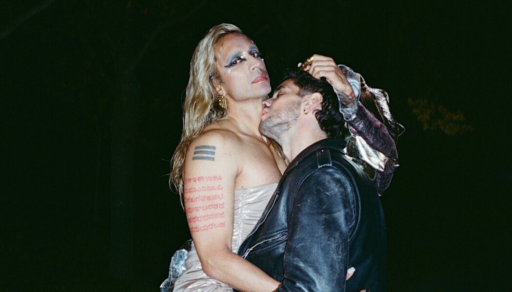 Vivek Shraya being kissed by a man