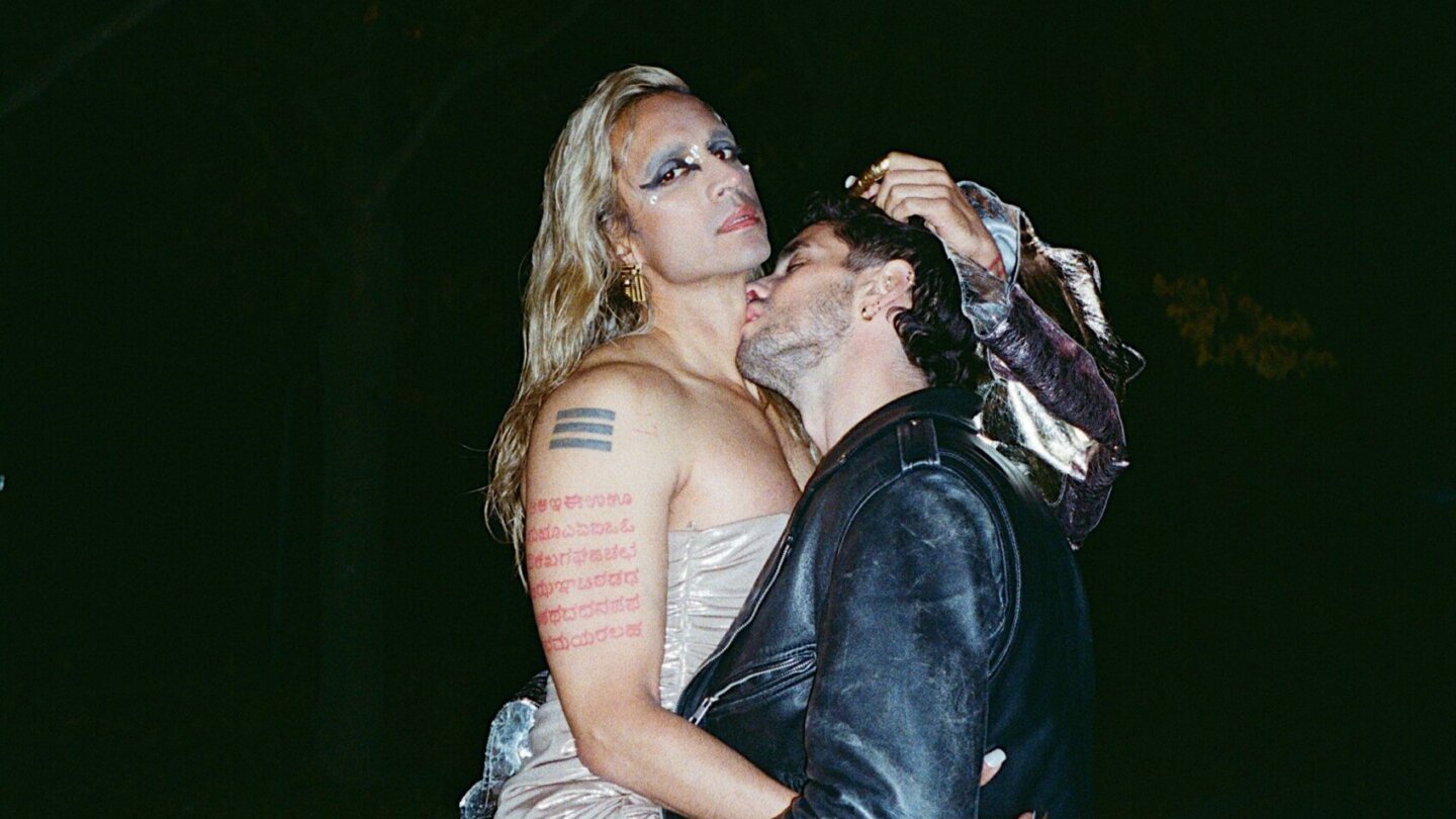 Vivek Shraya being kissed by a man