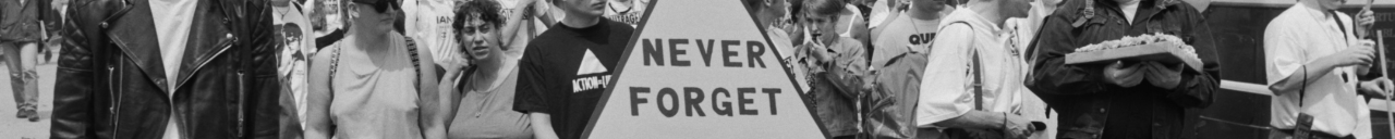 Marchers carrying a pink triangle with the words: 'Never Forget' at a Lesbian and Gay Pride event, London, 18th June 1994. The pink triangle symbol began as a badge used at Nazi concentration camps to identify gay men.