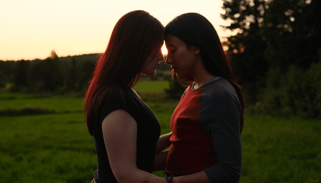 The protagonists of Blood Lines embracing