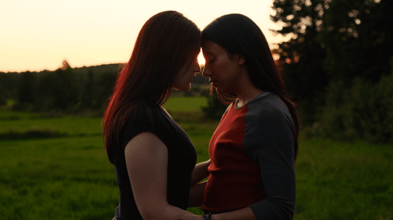 The protagonists of Blood Lines embracing