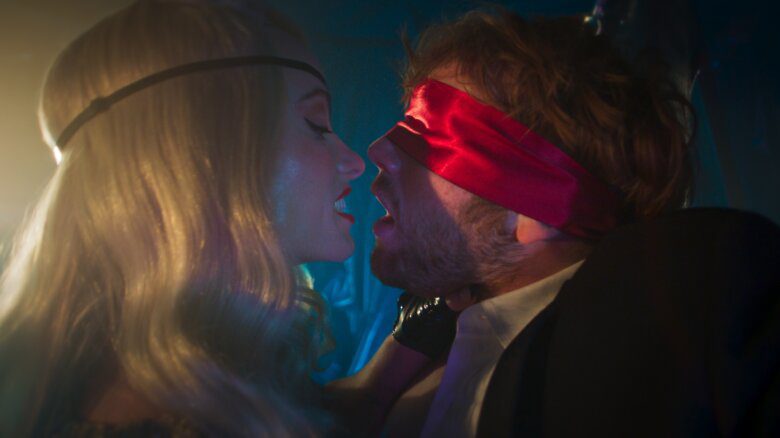 Olivia Wilde and Cooper Hoffman about to kiss