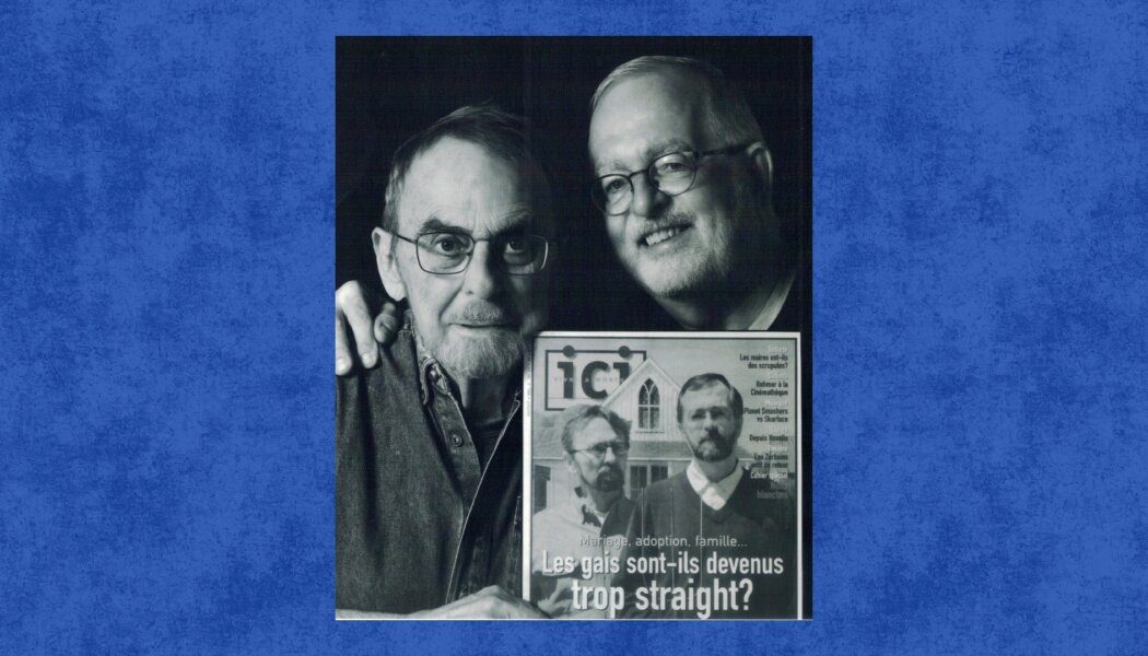 Michael Hendricks and René Leboeuf. Hendricks holds up an issue of Ici magazine that has him and Leboeuf on the cover.