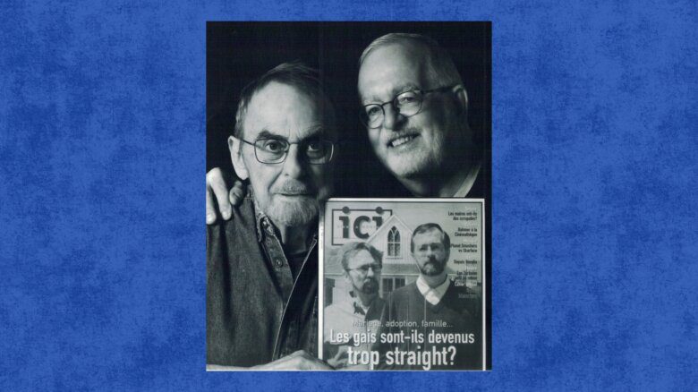 Michael Hendricks and René Leboeuf. Hendricks holds up an issue of Ici magazine that has him and Leboeuf on the cover.