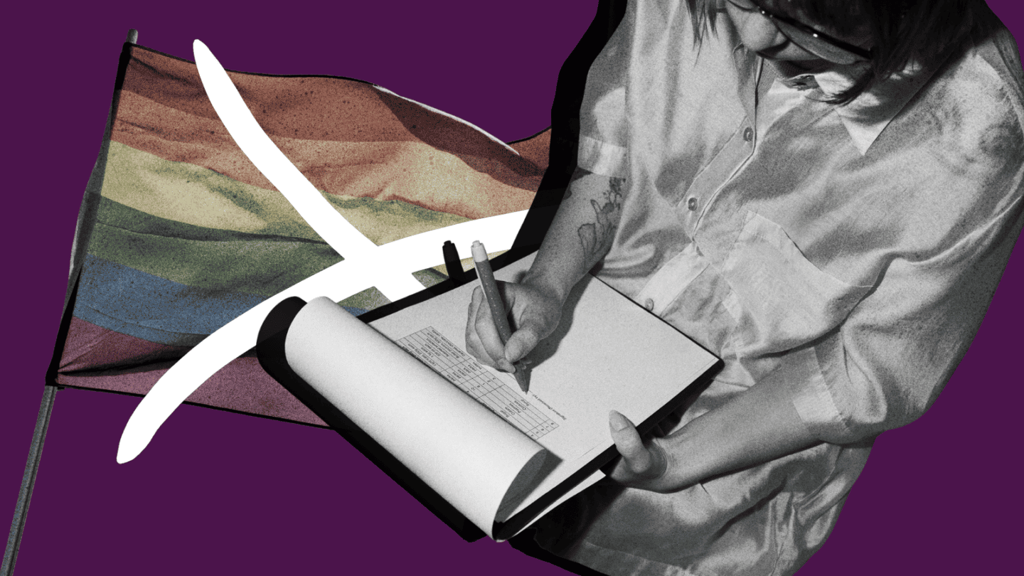 A Pride flag with an X over it in the background; a person in glasses and a satin shirt filling out a form in the foreground